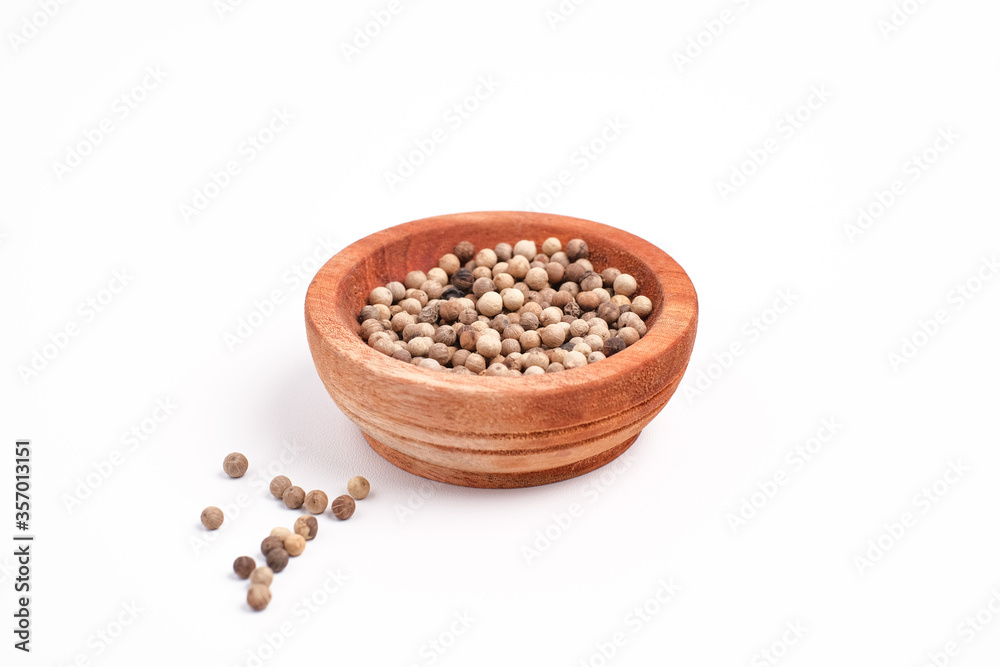 Whole white pepper spice, food closeup. Isolated on white background Whole white pepper spice, food closeup. Isolated on white background