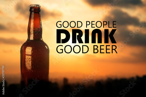 Beer related quote in a glass bottle over a bokeh background. Good people drinki good beer quote.