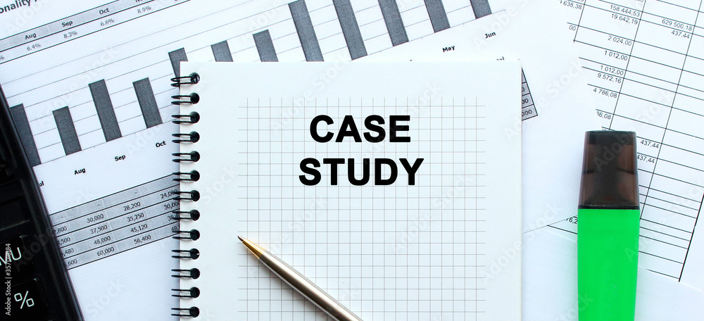 A notebook lies among the financial statements on the office desk. In the notebook, the inscription. calculator A notebook lies among the financial statements on the office desk. In the notebook, the inscription. calculator