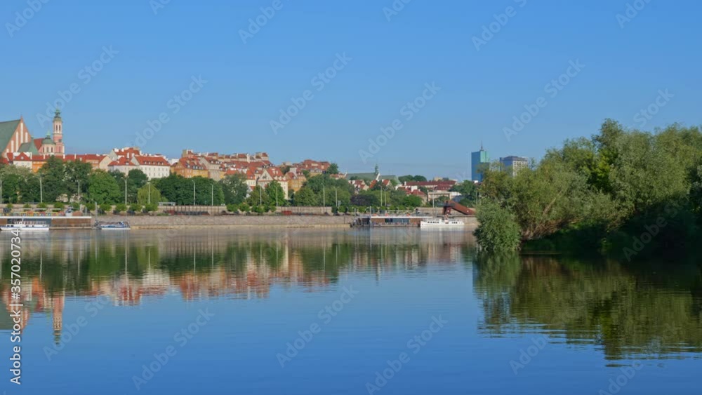 City of Warsaw in Poland, river view panning at sunrise along the Old Town skyline
City of Warsaw in Poland, river view panning at sunrise along the Old Town skyline