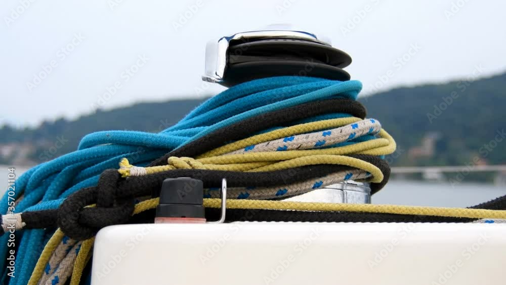 Isle Blocking Rope Close-up of blue and yellow and black wrapped ropes on cylinder ...