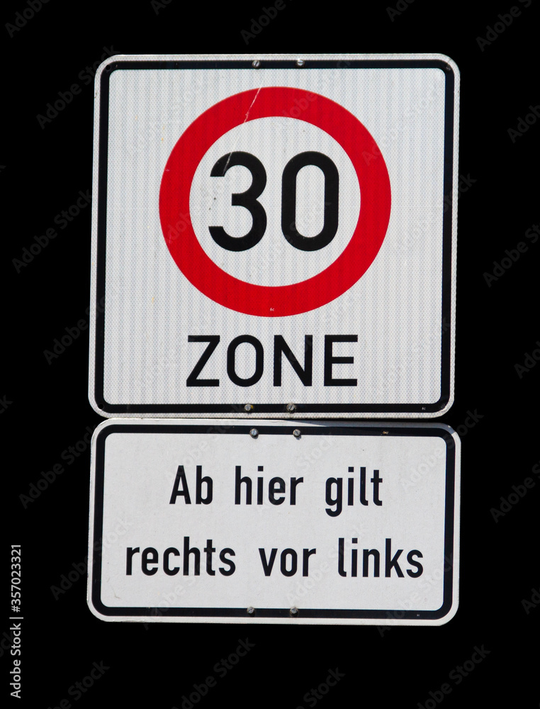 Isolated german sign with speed limit of 30 kilometer per hour and right has right-of-way sign Isolated german sign with speed limit of 30 kilometer per hour and right has right-of-way sign