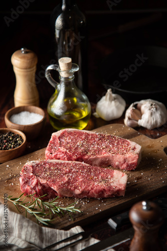 seasoned raw sirloin beef steak on cutting board