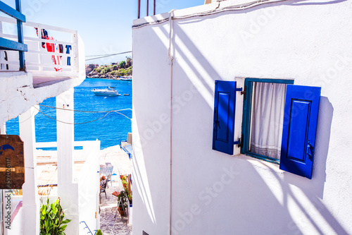A part of a traditional greek house with blue window in village of Loutro, Crete island, Greece