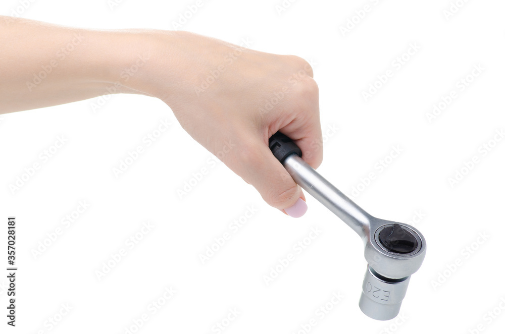Auto ratchet socket wrench in hand on white background isolation Auto ratchet socket wrench in hand on white background isolation