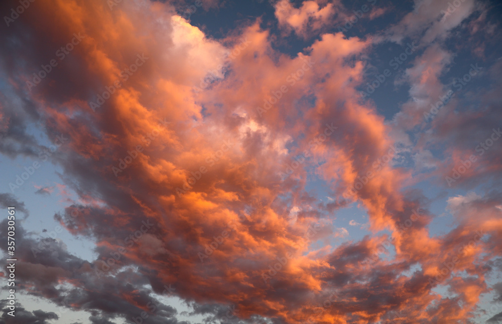 Red and Orange clouds at sunset above a beach in Costa Rica.