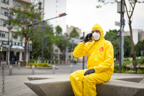 Man portrait with protection suit and mask for pandemic virus  