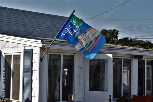 Dermot's Cottage with Take it easy flag photo