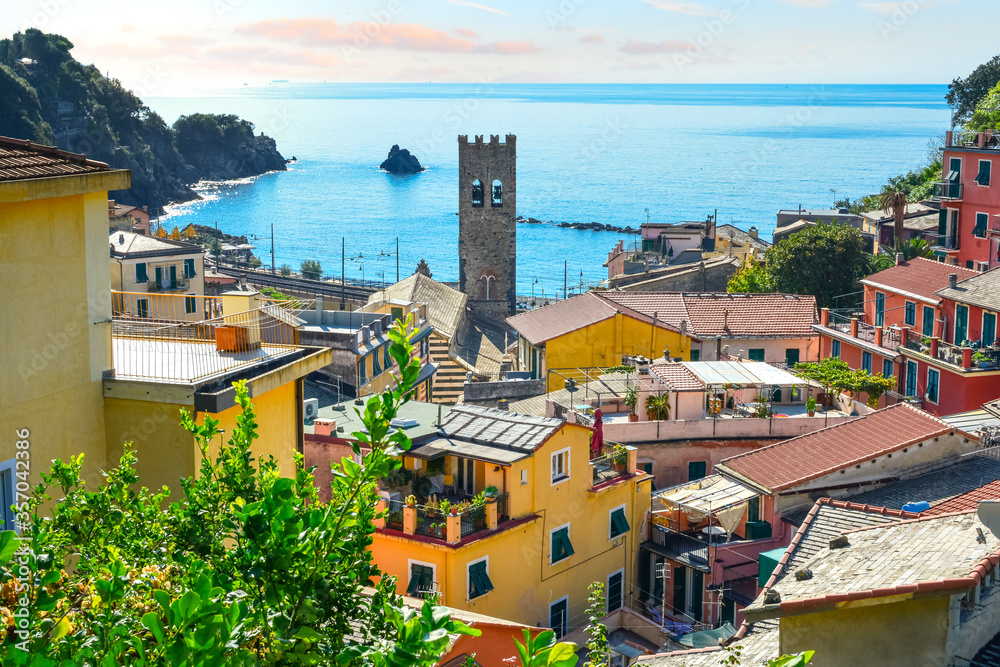 The blue Ligurian sea and coast from the town of Monterosso al Mare, on the Italian Riviera of Cinque Terre Italy with the church tower in view