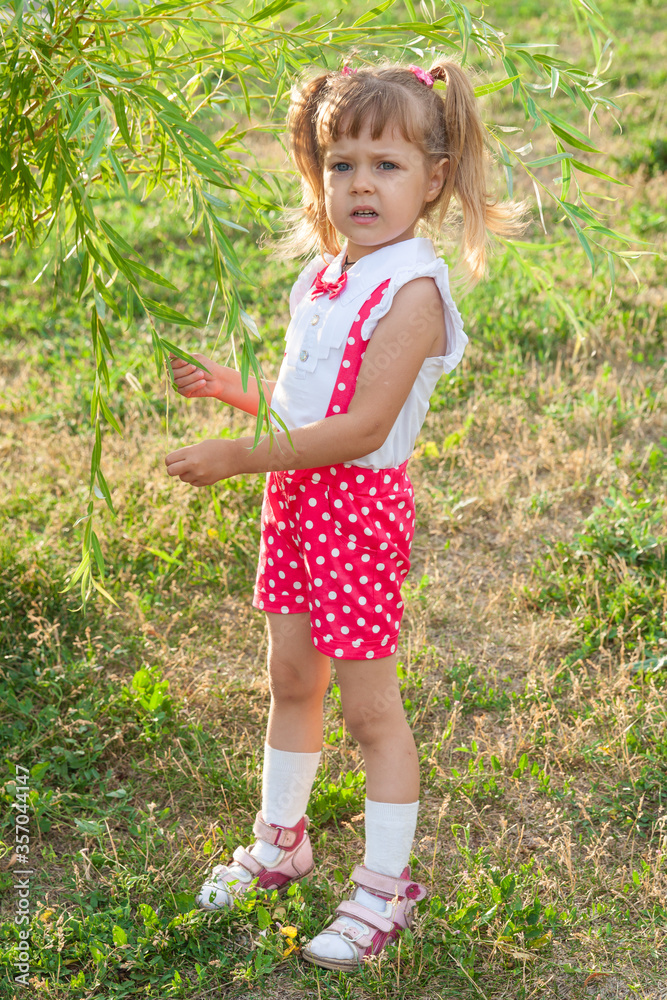 Little girl baby with tails in holiday clothes Little girl baby with tails in holiday clothes