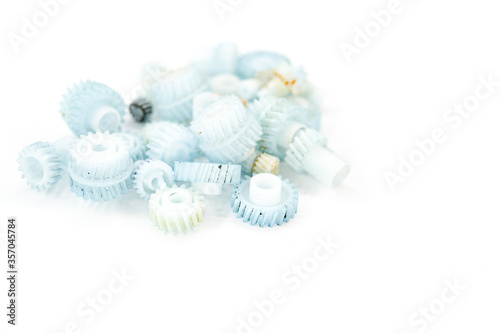 Dirty plastic gears on white background