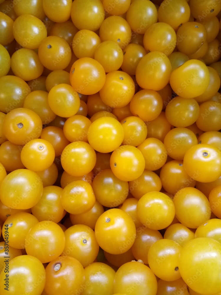 yellow cherry tomatoes in supermarket close-up yellow cherry tomatoes in supermarket close-up