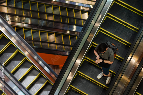 Photography Masked people on escalators
