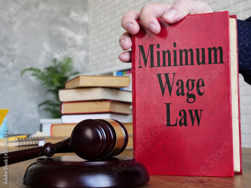 Minimum wage law is shown on the conceptual business photo photo