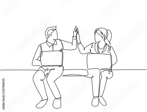 One line drawing of young happy couple business man and business woman opening their laptop and giving high five gestures. Business teamwork concept. Continuous line draw design vector illustration
