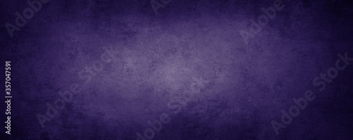 Dark purple textured stone wall wide background