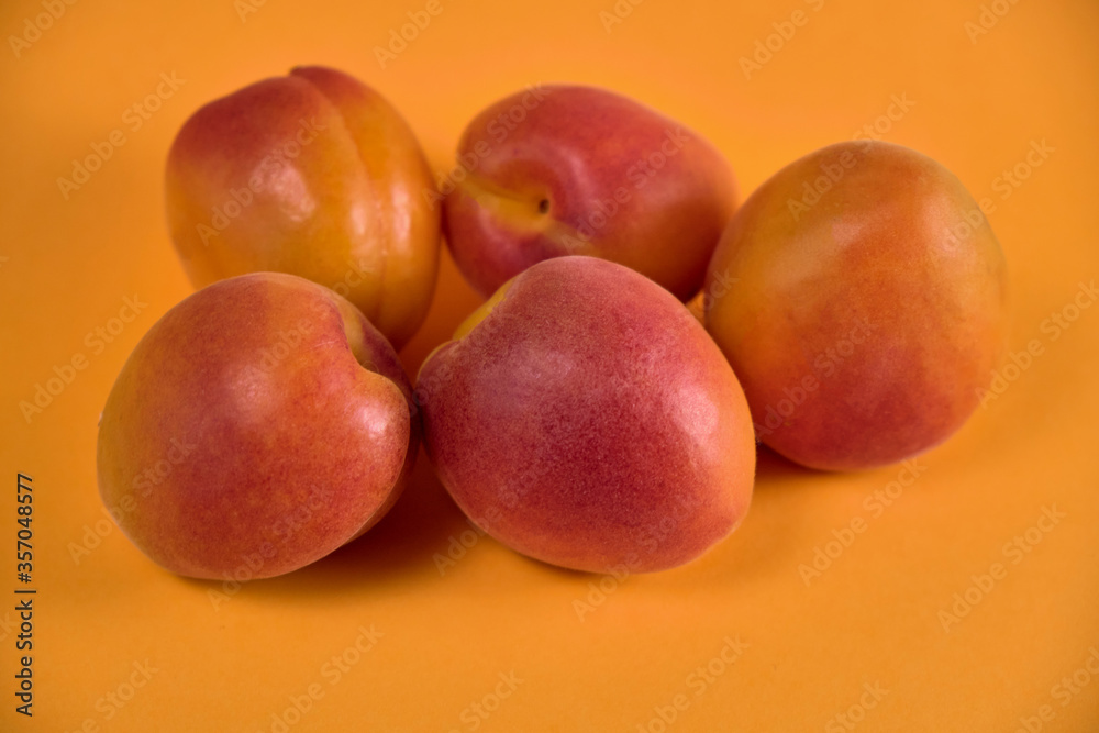 Fresh juicy apricots in a transparent glass plate. Macro. Fresh juicy apricots in a transparent glass plate. Macro.