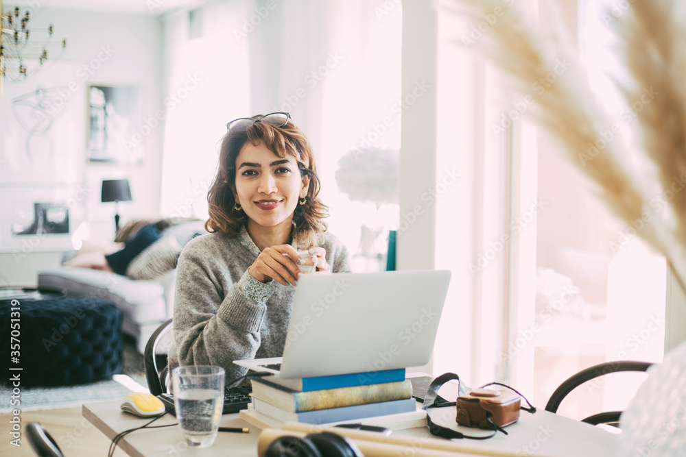 Portrait of woman working at home