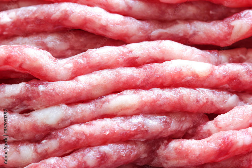 Fresh raw minced beef for cooking. Uncooked beef. Closeup minced beef. Fresh raw minced beef for cooking. Uncooked beef. Closeup minced beef.