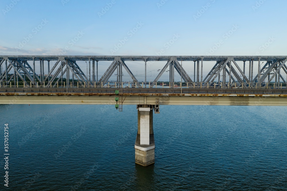 Highway and railway bridges over river. Aerial view.