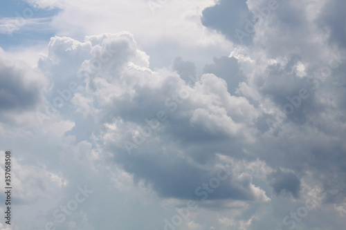 Fototapeta Naklejka Na Ścianę i Meble -  Light cumulus white clouds on a blue sky at daylight