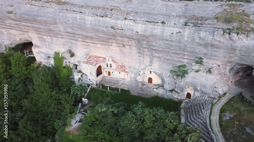 Aerial view of Saint Bernabe Ancient Heremitage in a cave in Ojo Guarena, Burgos, Spain. High quality 4k footage photo