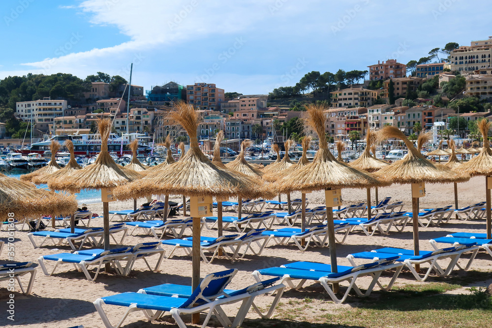 Ratan umbrellas on beach in Port de Soller, Mallorca