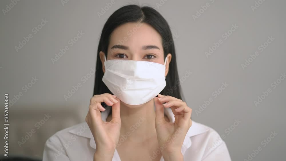 Beautiful woman takes her medical mask protect corona virus , covid-19 Beautiful woman takes her medical mask protect corona virus , covid-19