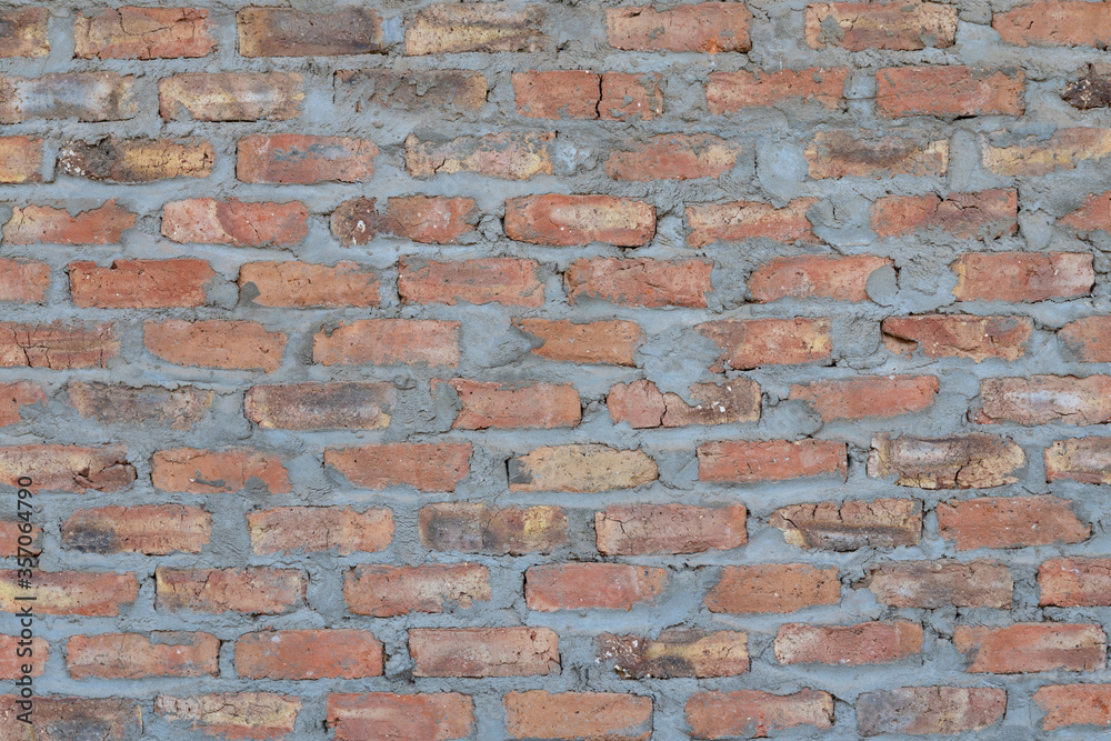 Obraz premium Closeup of weathered brick wall texture