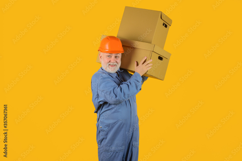 Delivery from shop. Bearded man carry boxes. Delivery service. Shipment. Delivery concept. Delivery man with boxes. Man holds cardboard box. Delivery from shop. Bearded man carry boxes. Delivery service. Shipment. Delivery concept. Delivery man with boxes. Man holds cardboard box.