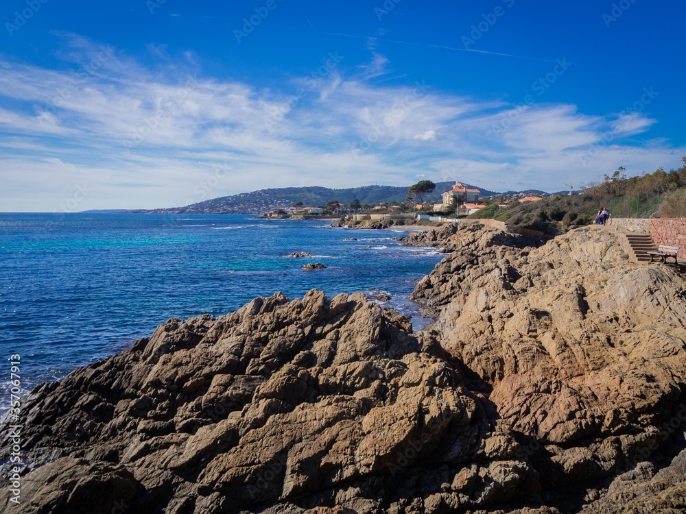 beautiful rocky coast, azure water and blue sky in Sunny weather in Saint Aygulf, France