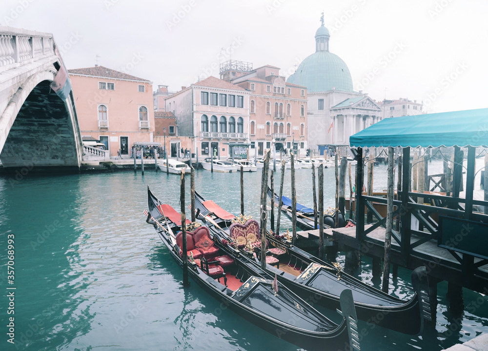Detals of Venetian canal with gondola. Gondola and old architecture are main touristic attraction at Venezia. Famous travel destination in Europe, Venice.