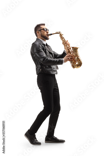 Young handsome man playing a saxophone