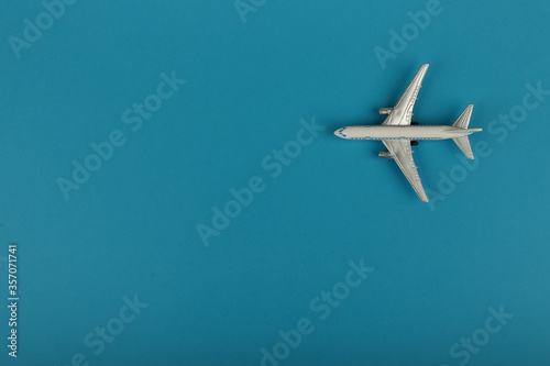 toy air plane on blue background top view with copy space © Петр Смагин