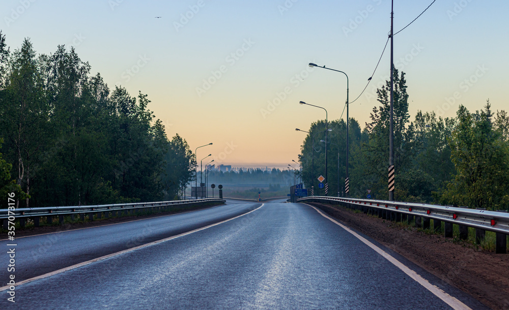 Highway at dawn . Beautiful road. Road landscape. Travel by car.