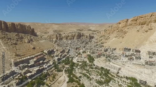 Rock and towers of convent Takla in Maalula near Damascus, Syria (aerial photography) photo