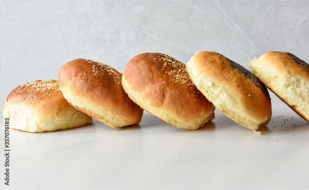 hot homemade buns with sesame and poppy seeds