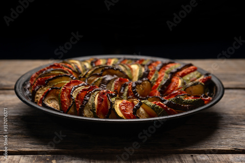 French baked ratatouille on wooden background