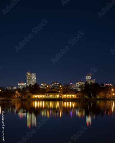 City Park Pavilion and the Denver Skyline reflecting in Ferril Lake. 