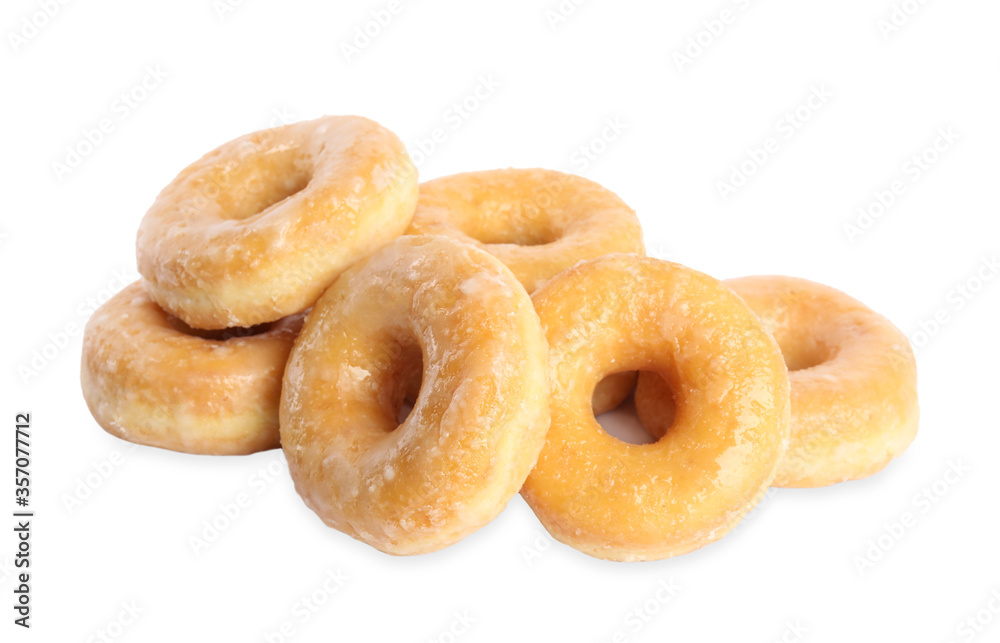 Sweet delicious glazed donuts on white background