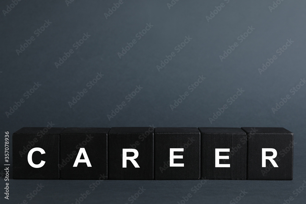 Black cubes with word CAREER on dark background. Space for text Black cubes with word CAREER on dark background. Space for text