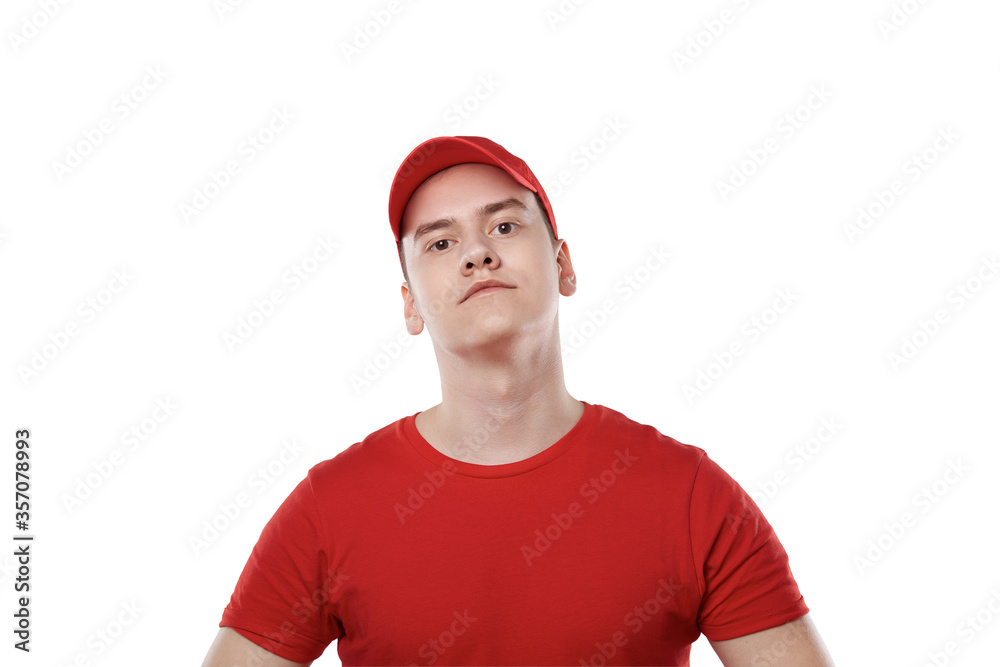 Portrait of a young guy from a delivery service. Red uniform. Portrait of a young guy from a delivery service. Red uniform.