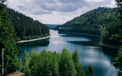 River surrounded by forests under a cloudy sky in Thuringia in Germany - great for natural concepts
