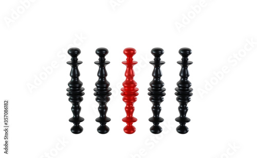 the red chess pawn, stands in a crowd of black pawns. chess pawns with a mirror image. Isolated on white background. 3D rendered.
