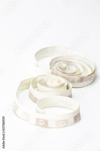 Cycling Related Ideas. White Dirty Used Bike Handlebars Bar Tape Against White Background. photo