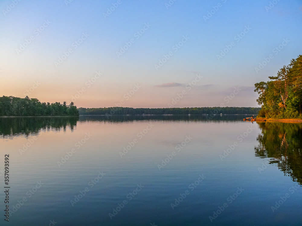 Reflection of a blue-and-pink sky on a lake