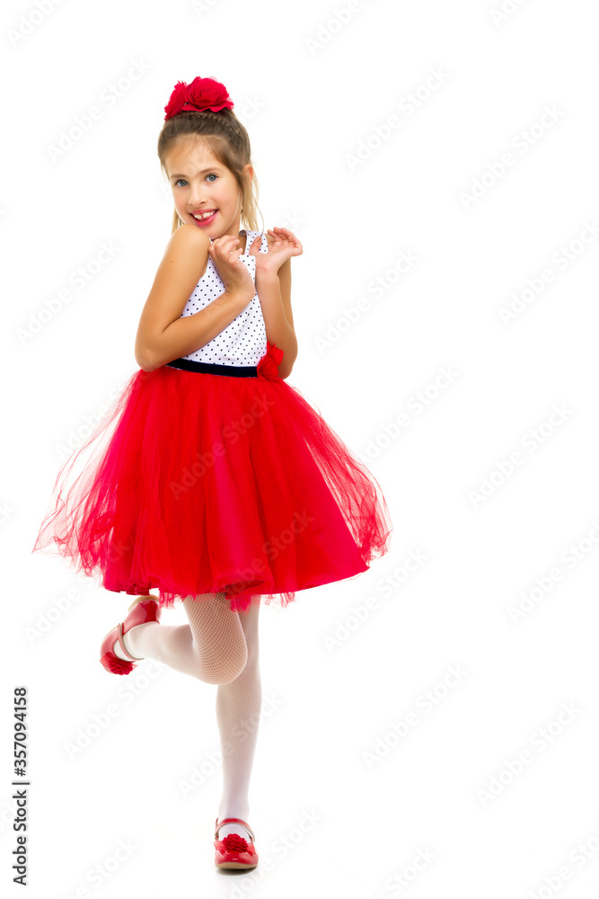 Little girl in an elegant dress.The concept of a happy childhood Little girl in an elegant dress.The concept of a happy childhood