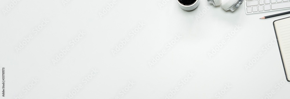 Top view white office desk table with blank notebook, computer keyboard and other office supplies. with copy space, flat lay. Top view white office desk table with blank notebook, computer keyboard and other office supplies. with copy space, flat lay.