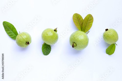 Fresh ripe guava and slices with leaves. Top view photo