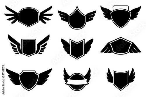 Set of the empty emblems with wings. Design element for logo, label, sign. badge. Vector illustration